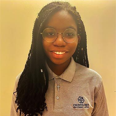 Head and shoulders picture of MathWorks work-study student Chanelle. She is wearing her Cristo Rey uniform and a big smile.